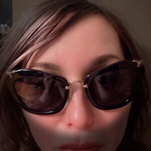 Chic Miu Miu Black and Gold Sunglasses with Cat-Eye Design, like New